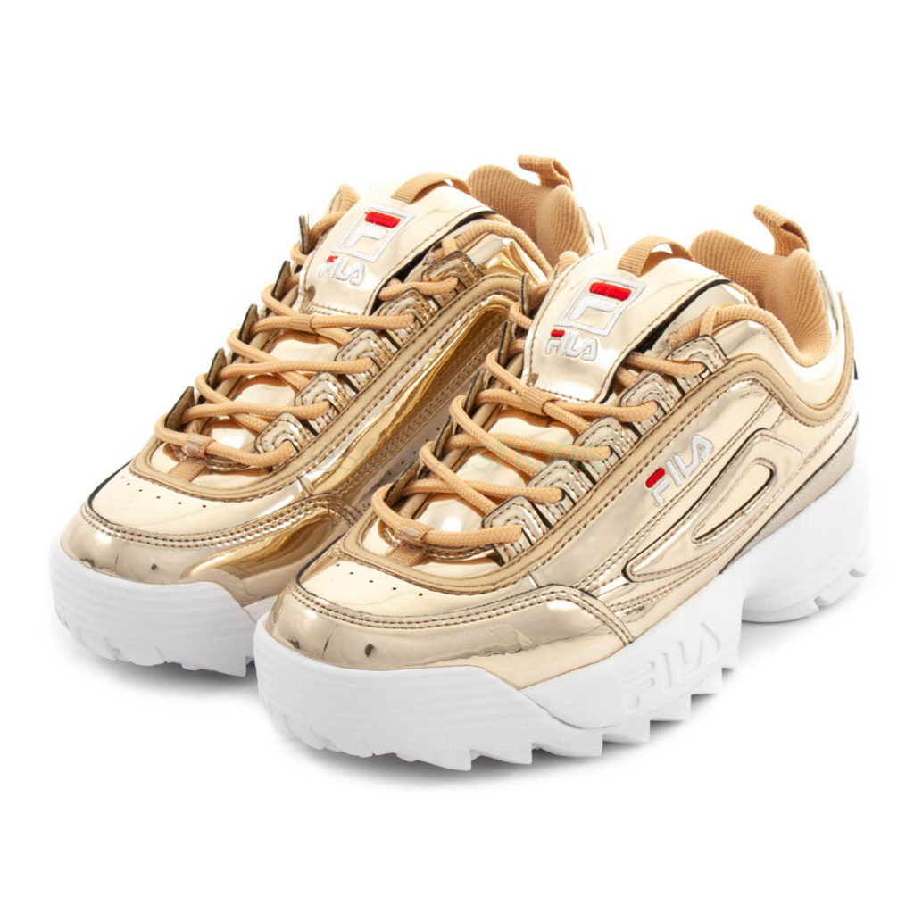 white and gold fila trainers